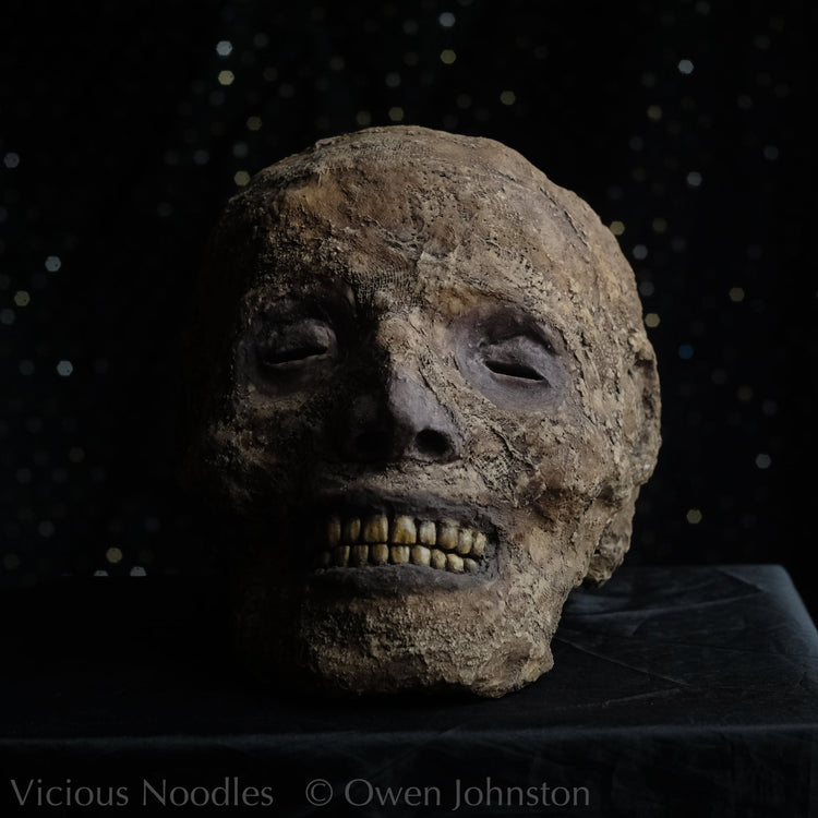 Replica mummified heads