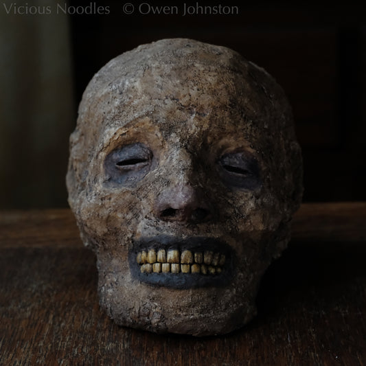 Replica mummified head