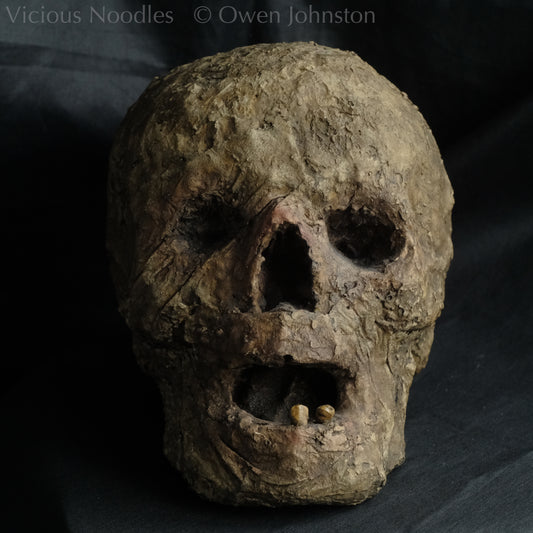 Replica mummified head