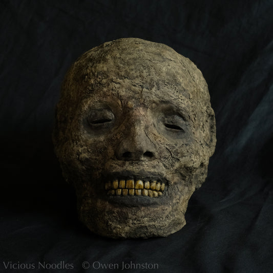 Replica mummified head